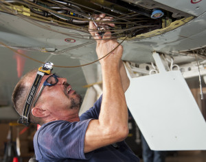 electrician-updating-ceiling-wiring